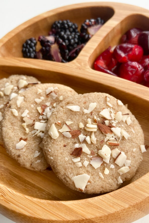 Almond cookies served with blackberries and cherries