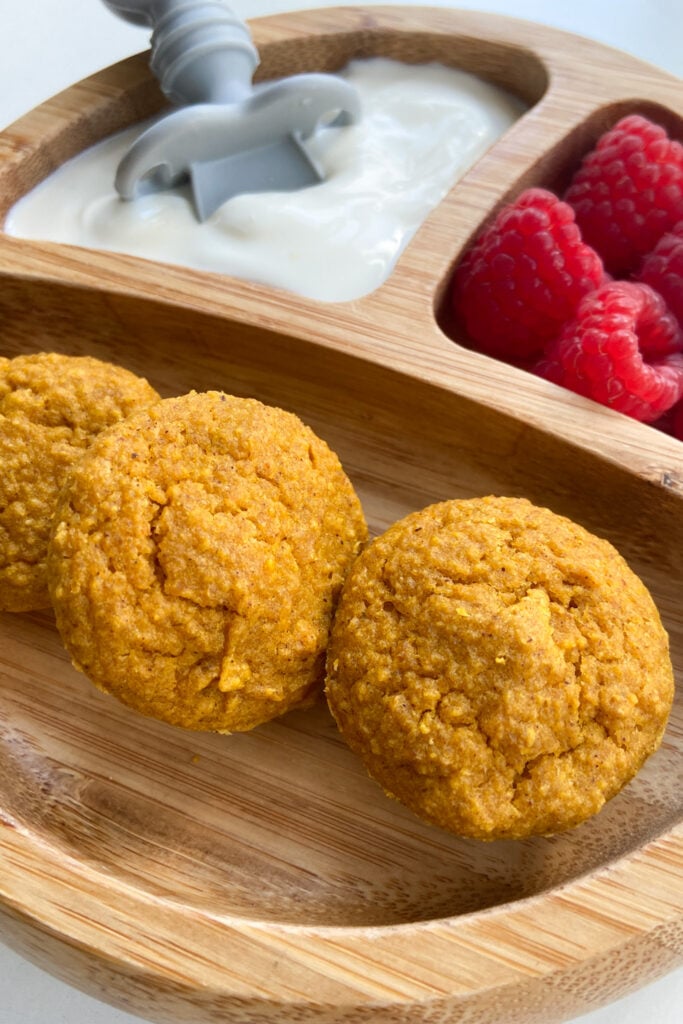 Pumpkin muffins served with yogurt and raspberries