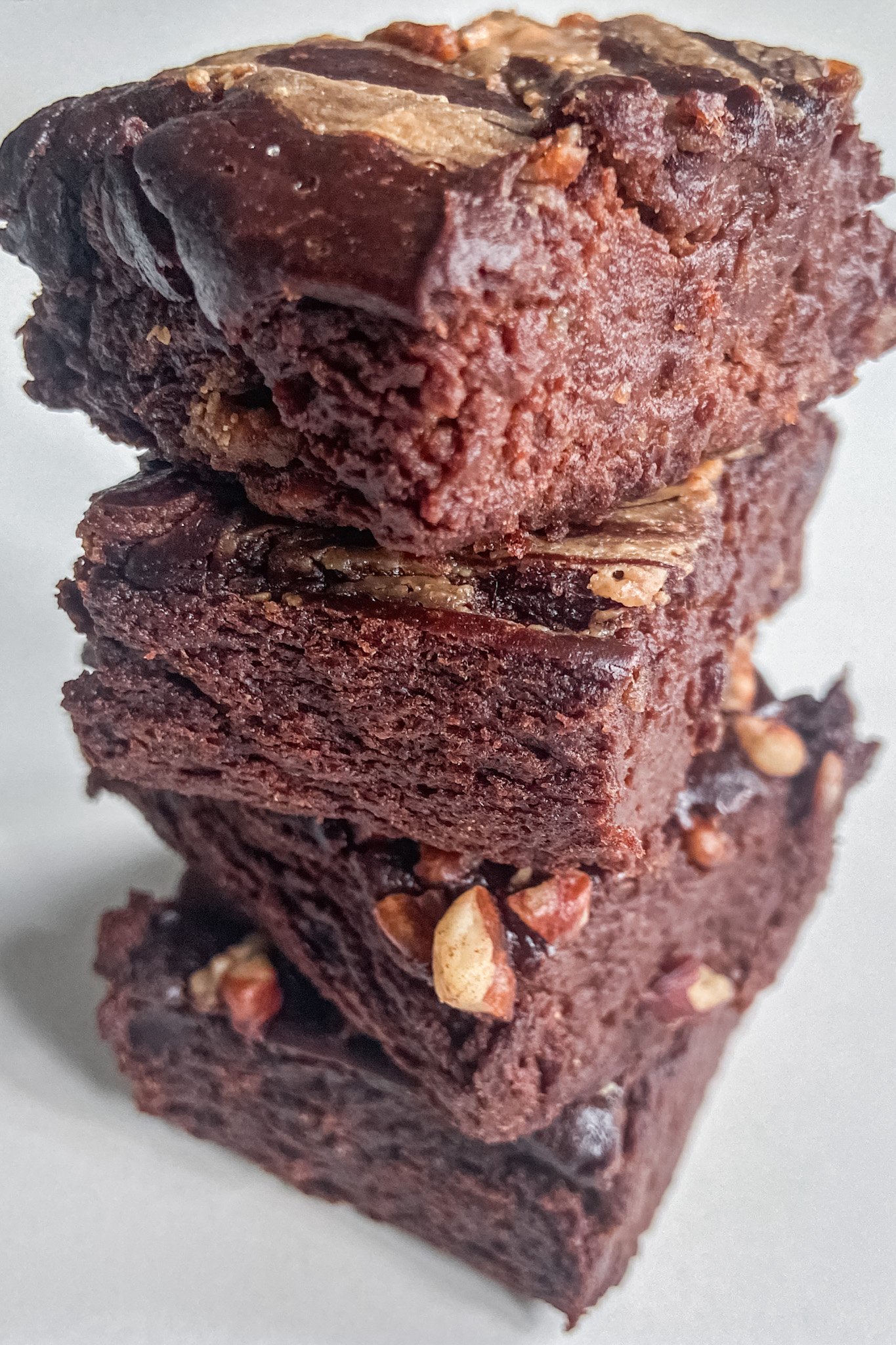 3-ingredient brownies stacked on on top of the other