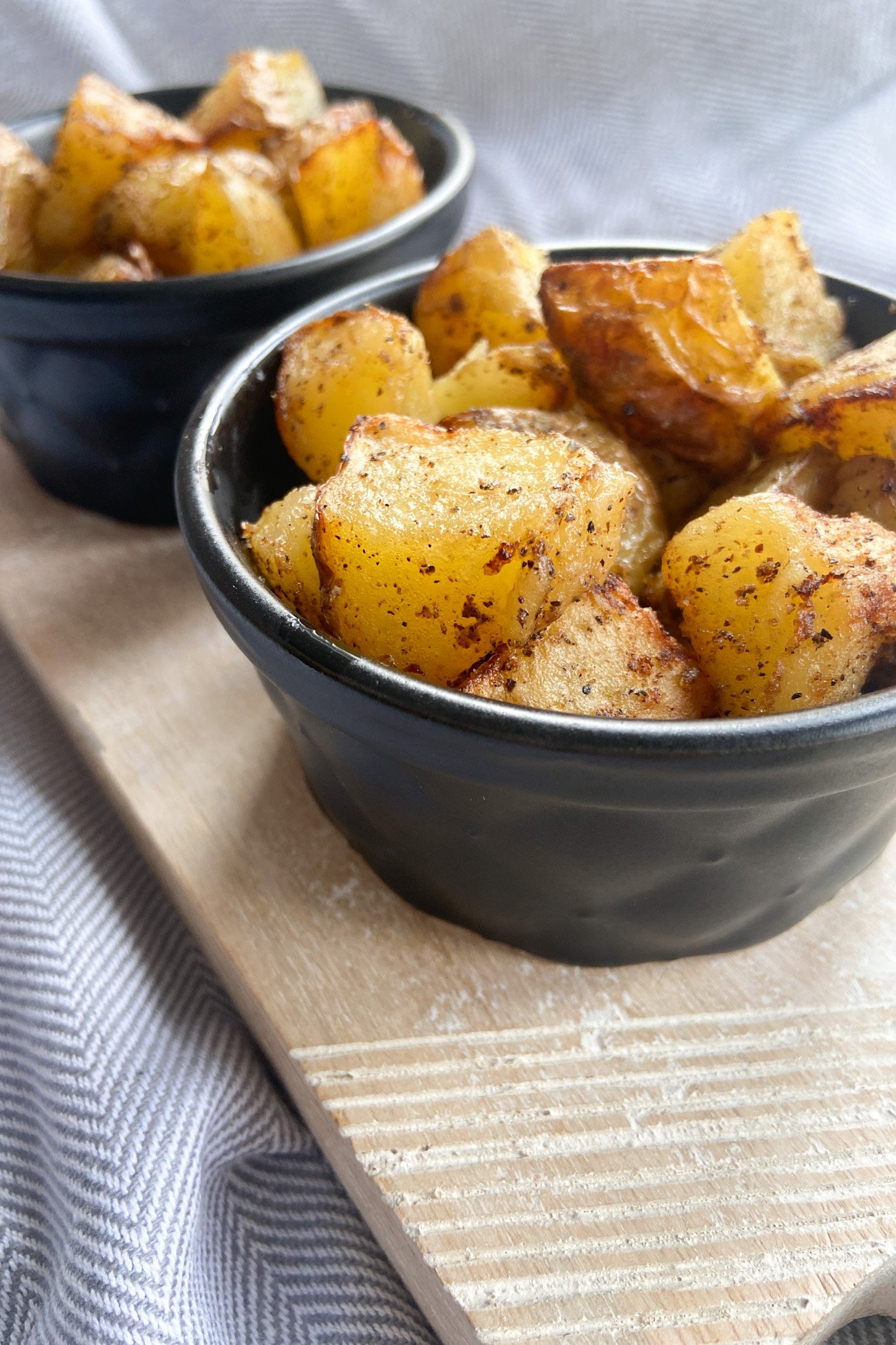 Air fryer gold potatoes served in a black bowl
