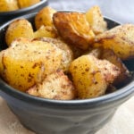 Air fried gold potatoes served in a black bowl