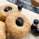 Peanut butter and jelly muffins served on a wooden cutting board