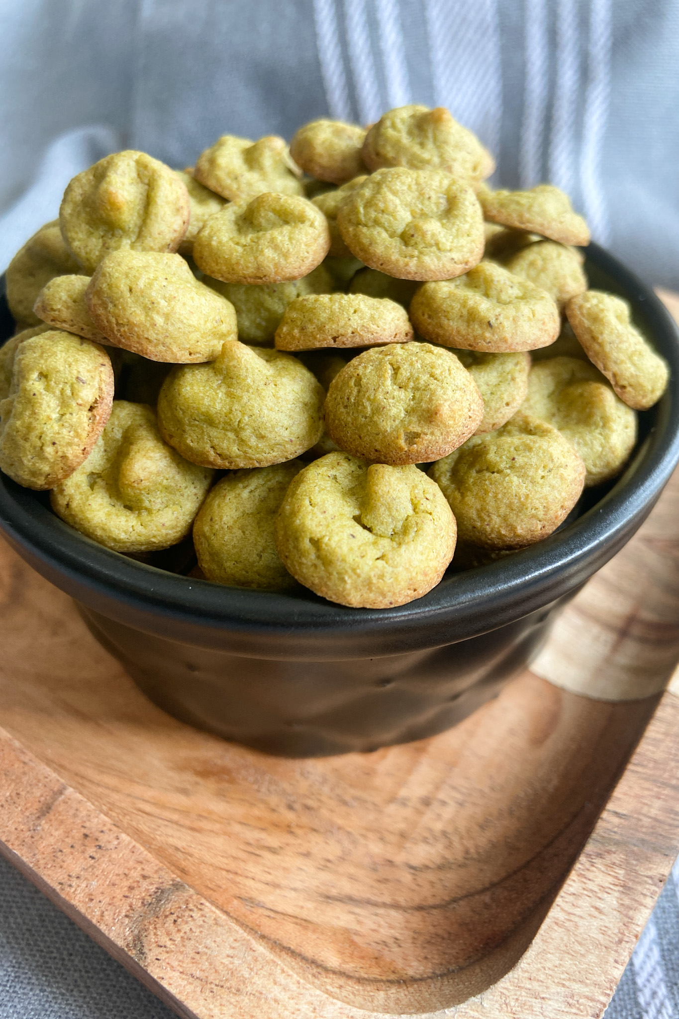 Spinach banana puffs served in a black container