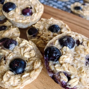 Berry oatmeal bites served on a wooden cutting board