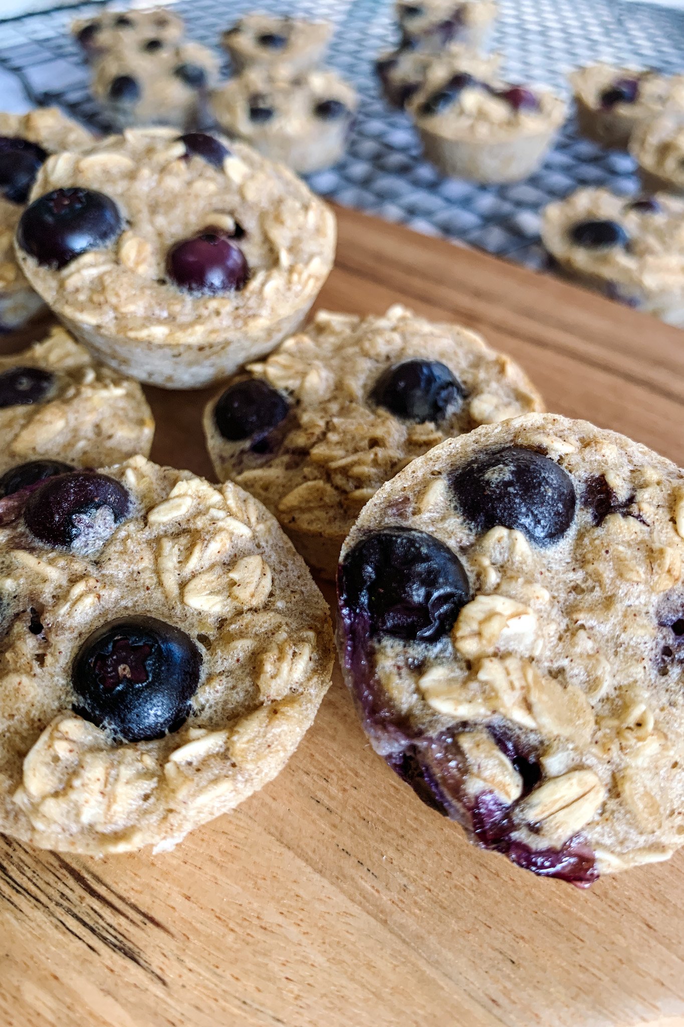 Blueberry banana oatmeal bites served on a wooden cutting board