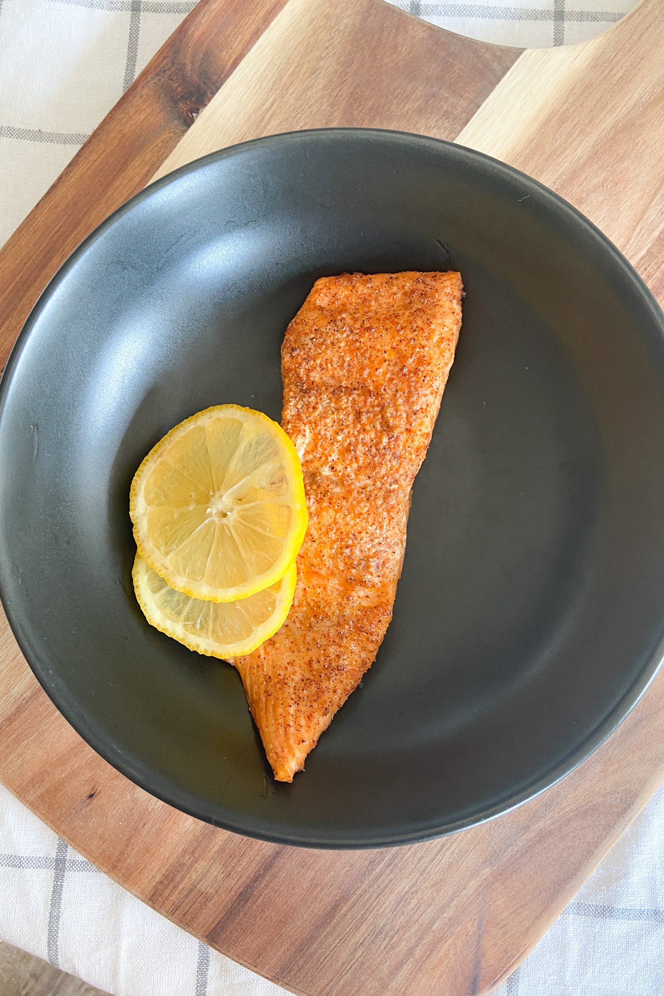 Air fryer salmon garnished with lemon
