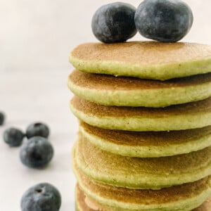 Spinach banana pancakes topped with blueberries