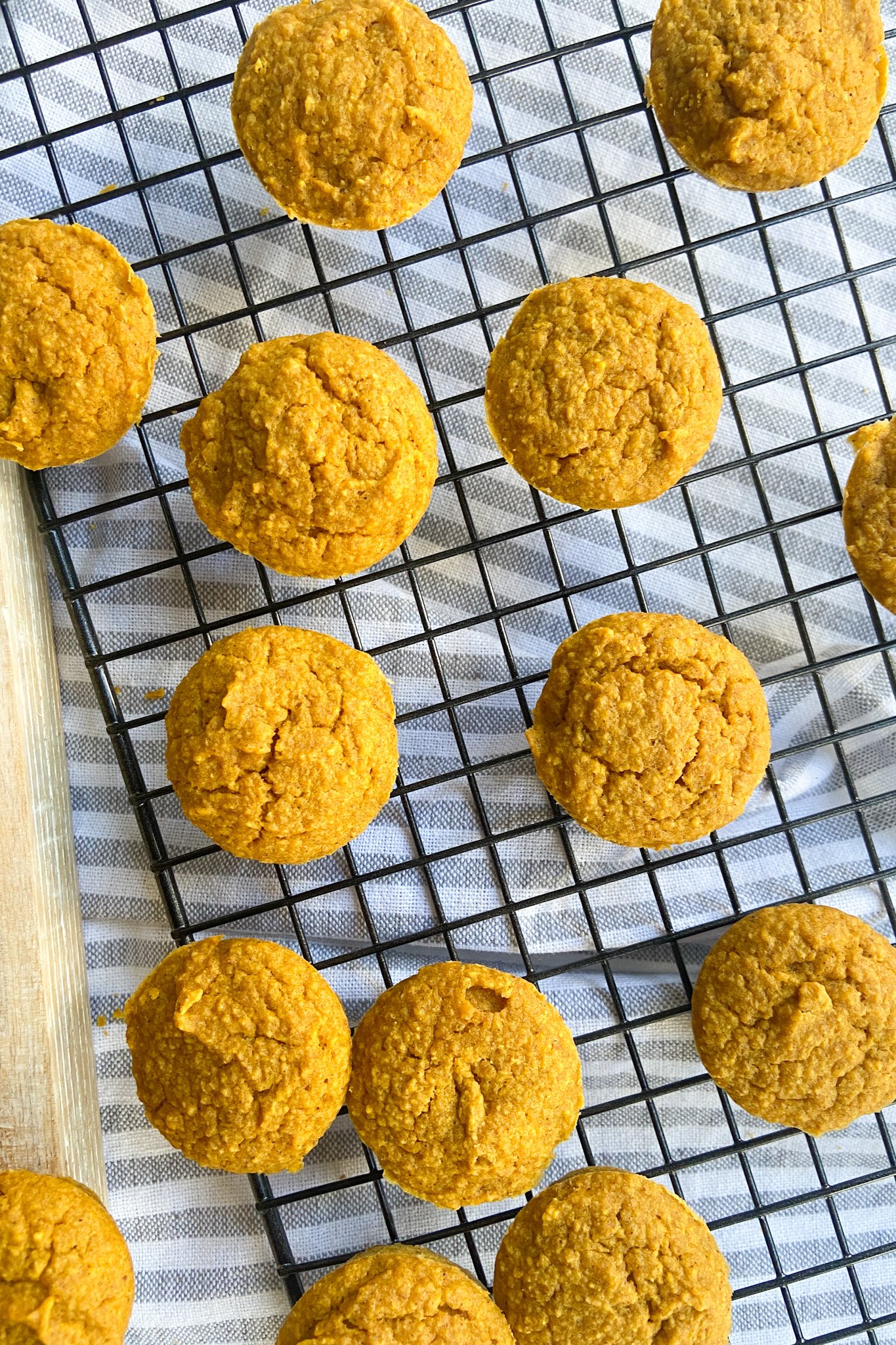 Pumpkin muffins cooling on a cooling rack