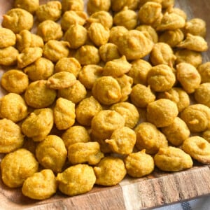 Pumpkin puffs served on a wooden plate