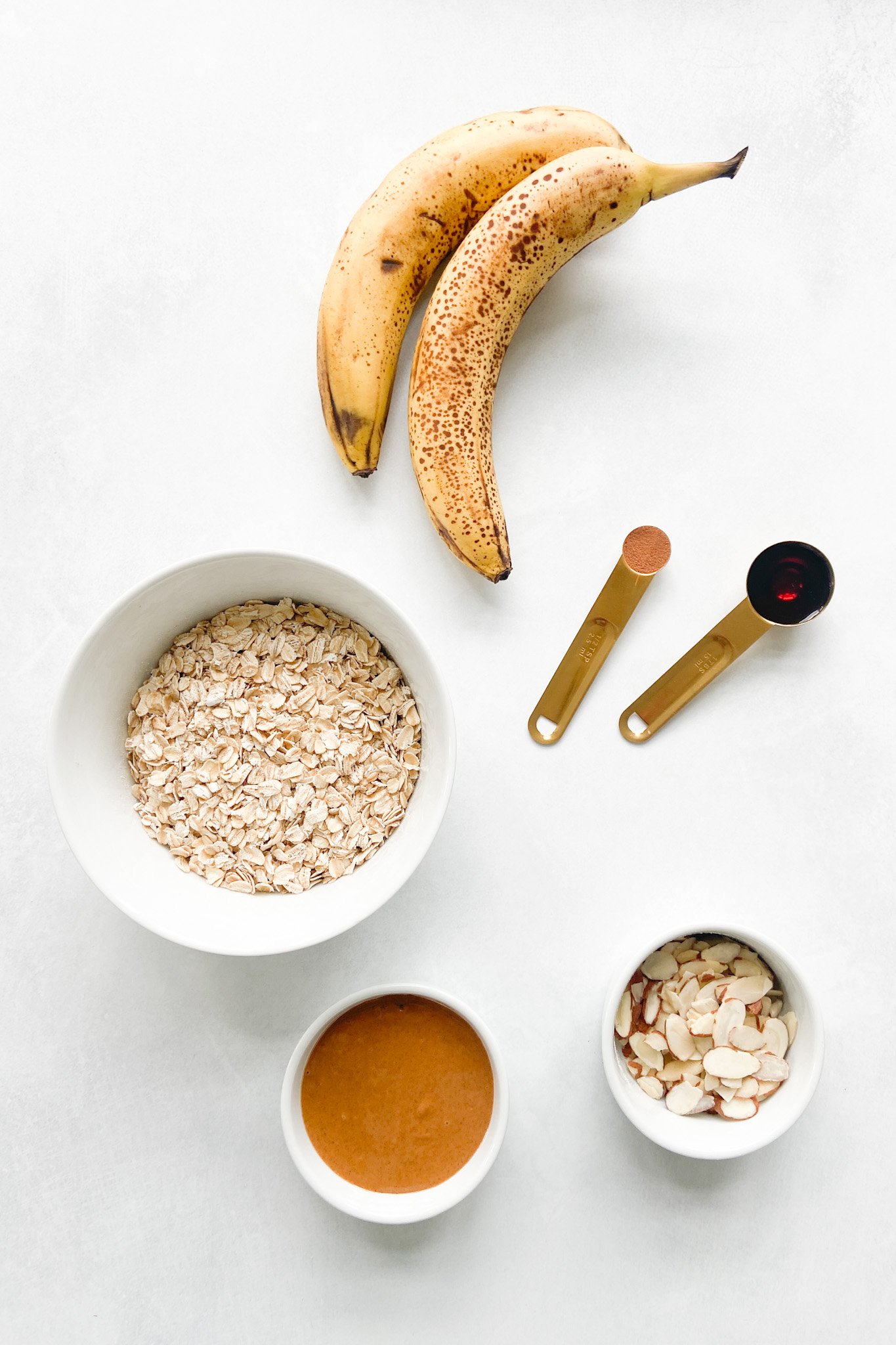 Ingredients to make peanut butter and banana granola bars. See recipe card for detailed ingredient quantities.