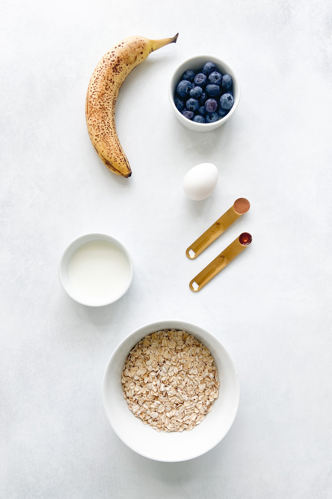 Ingredients to make blueberry banana oatmeal bites. See recipe card for detailed ingredient quantities.