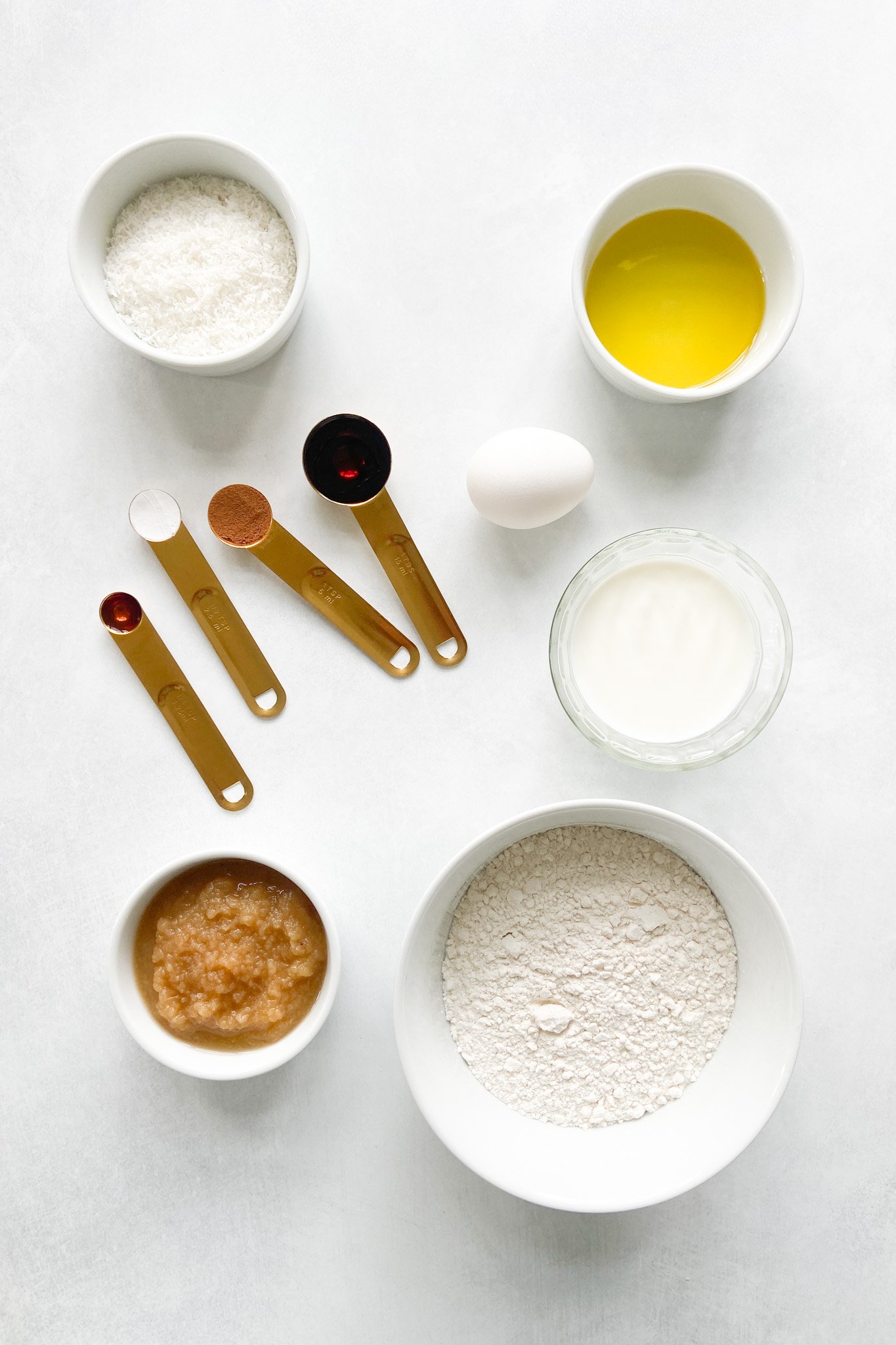 Ingredients to make coconut donuts. See recipe card for detailed ingredient quantities.