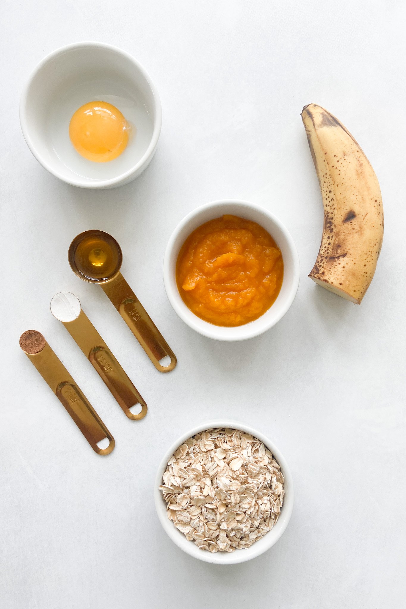 Ingredients to make pumpkin banana puffs. See recipe card for detailed ingredient quantities.