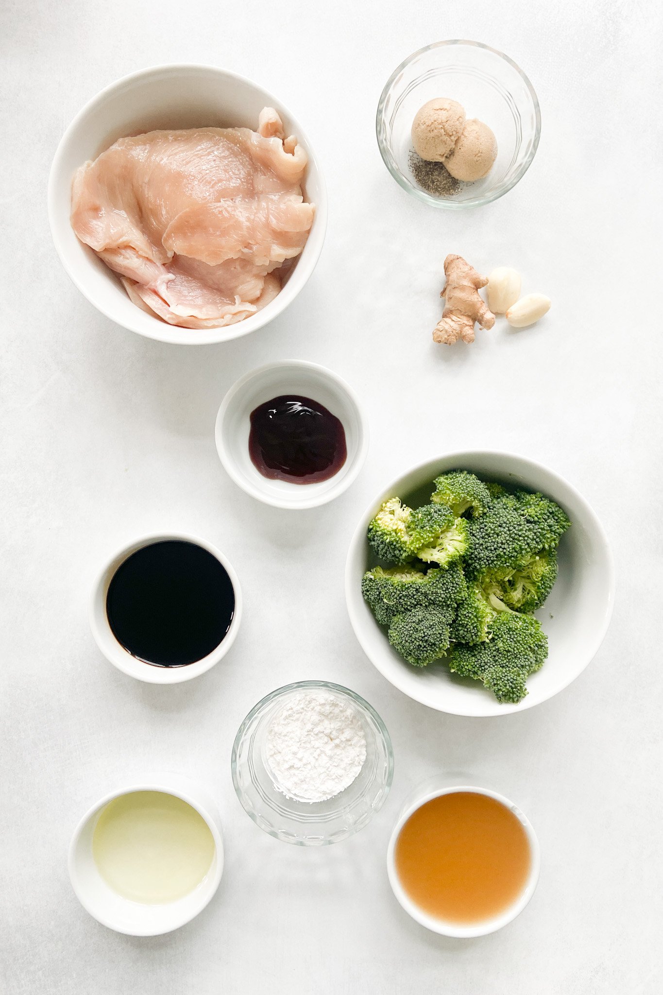 Ingredients to make chicken and broccoli stir-fry. See recipe card for detailed ingredient quantities.