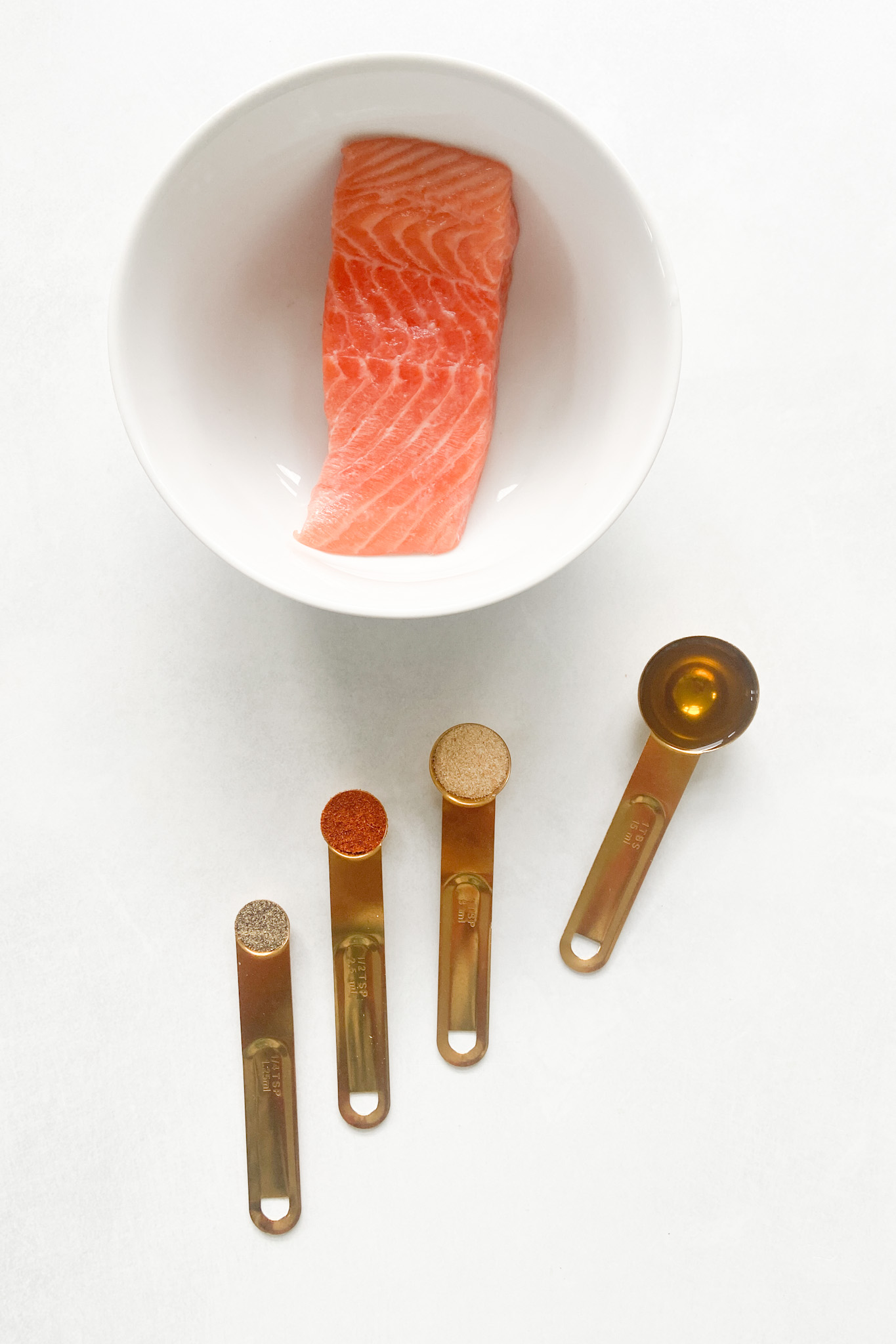 Ingredients to make air fryer salmon. See recipe card for detailed ingredient quantities.