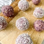 Blueberry bliss balls served on a wooden cutting board