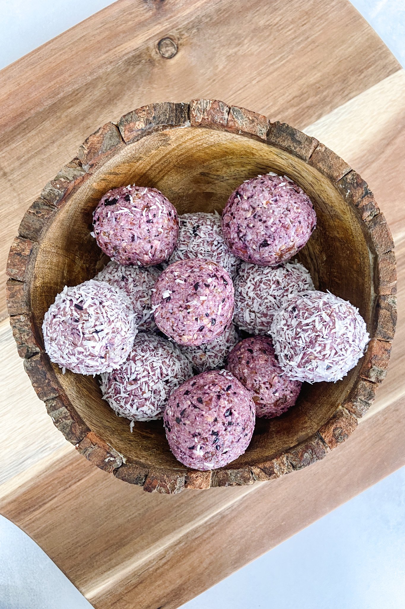 Blueberry bliss balls served in a wooden bowl