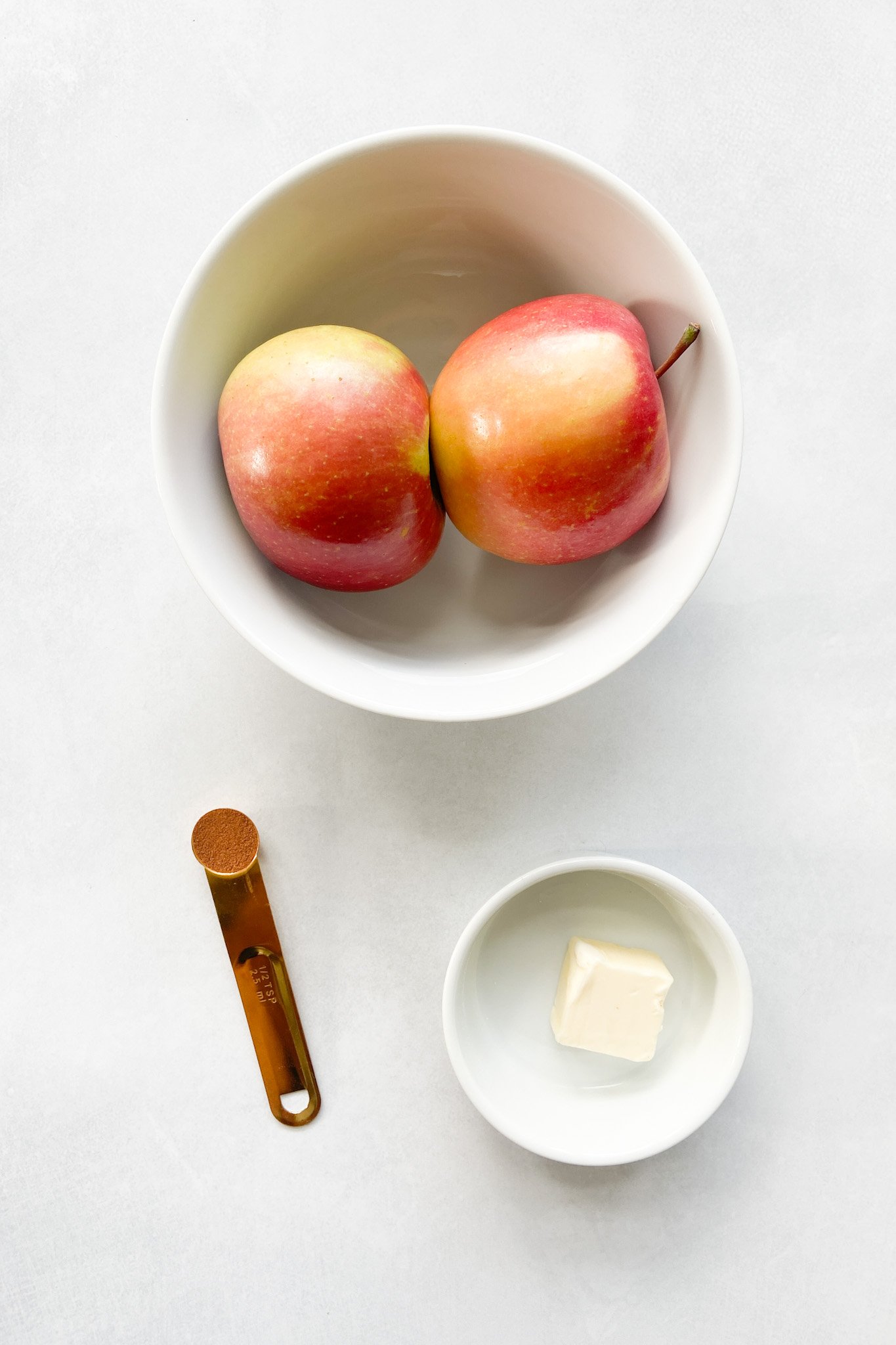 Ingredients to make cinnamon apples. See recipe card for detailed ingredient quantities.