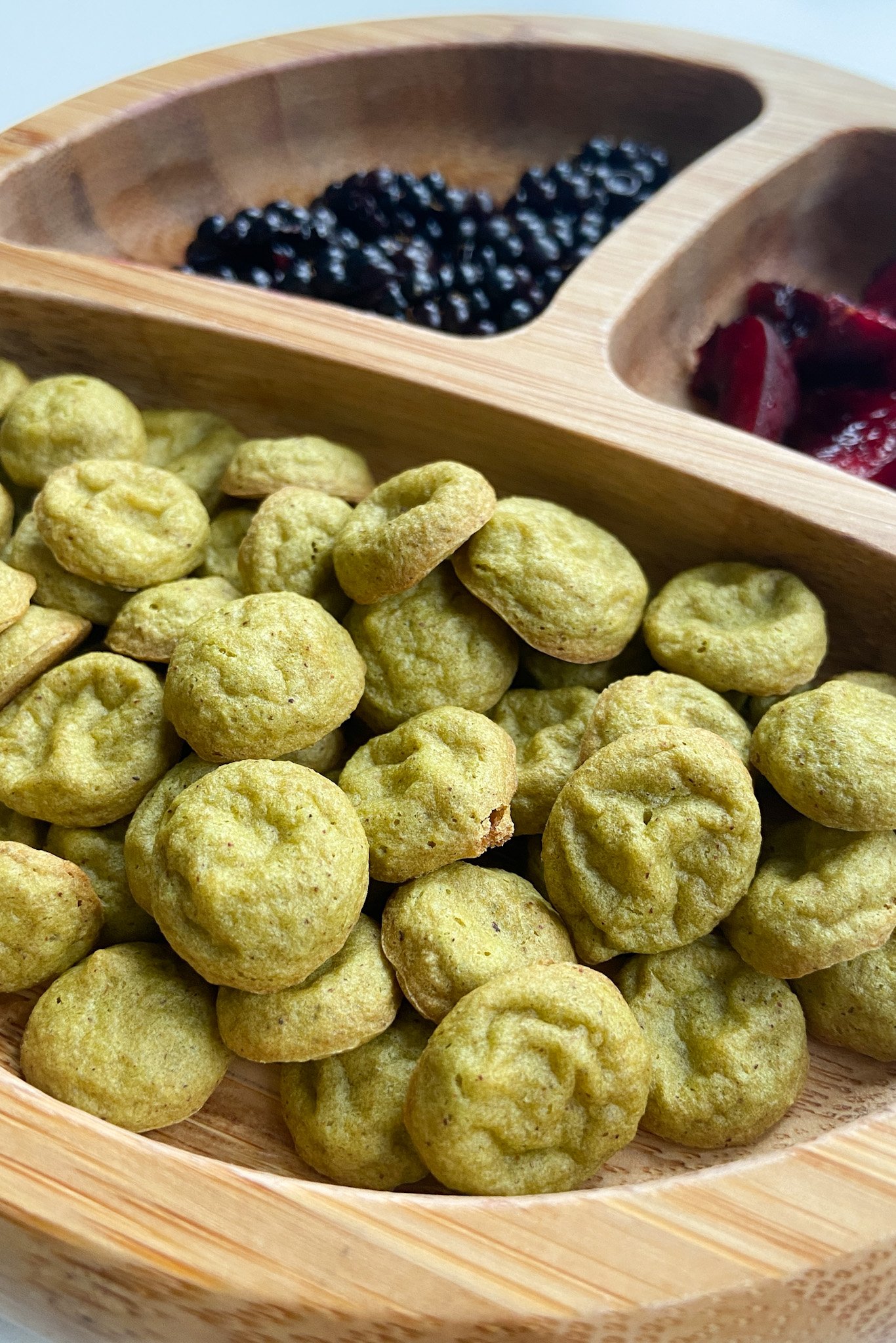 Spinach banana puffs served with blackberries and cherries