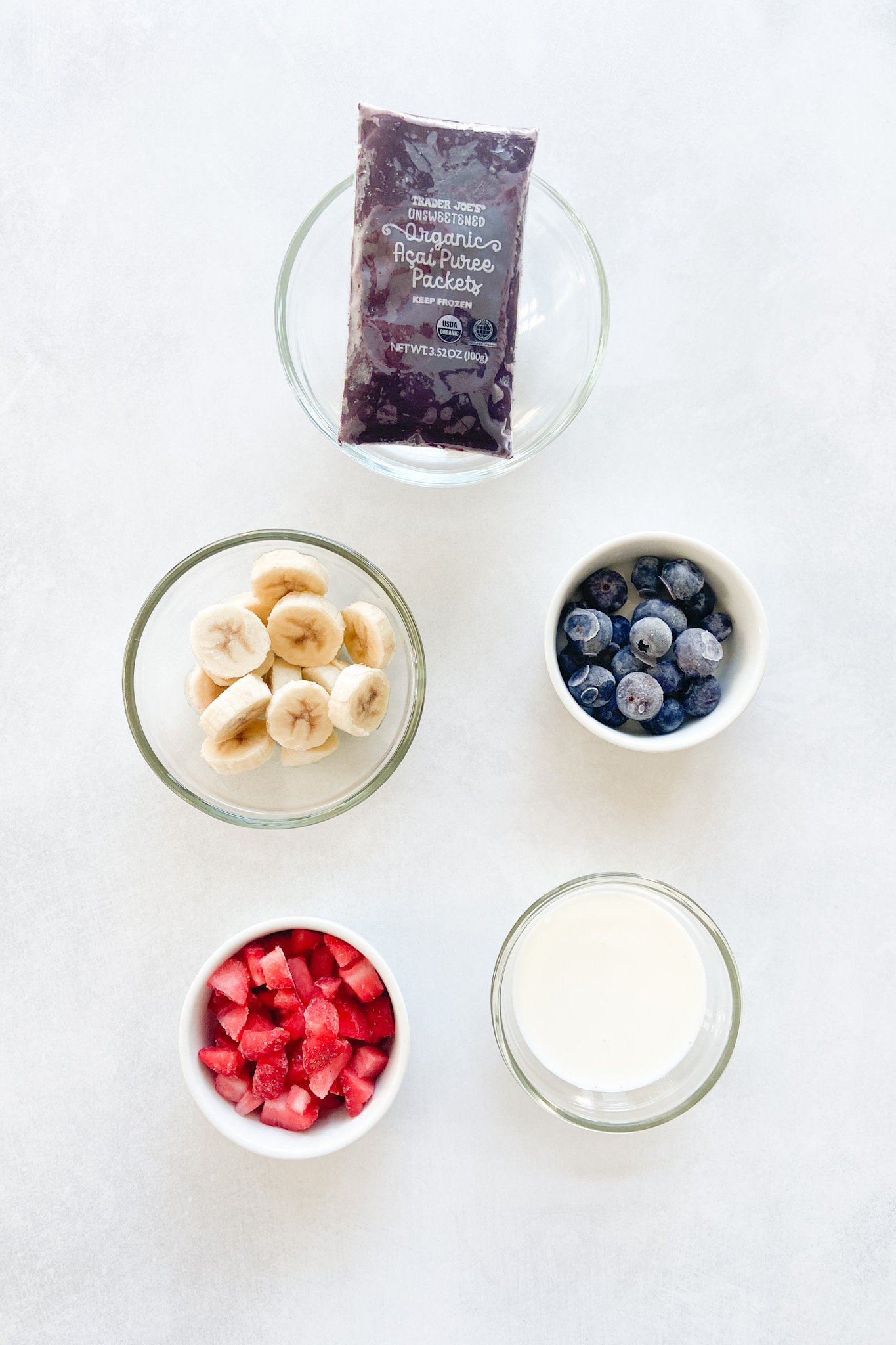 Ingredients to make Acai bowls. See recipe card for detailed ingredient quantities.