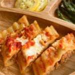 Cheesy beef manicotti sliced into pieces. Served with sliced yellow squash and asparagus.