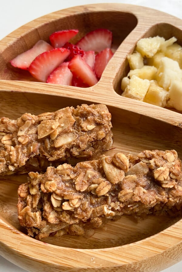 Peanut butter and banana granola bars served with strawberries and bananas