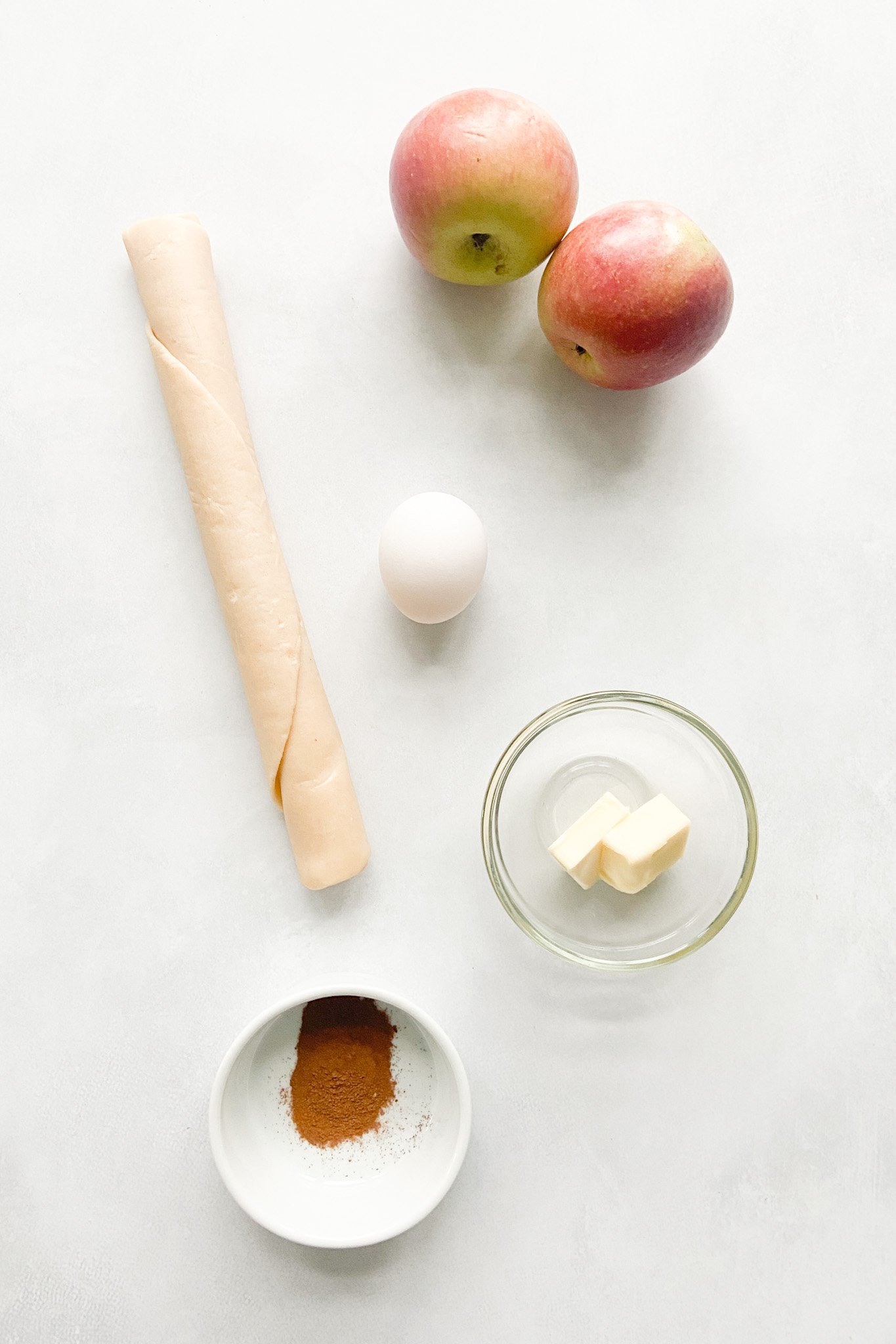 Ingredients to make apple pie empanadas. See recipe card for full ingredient details.