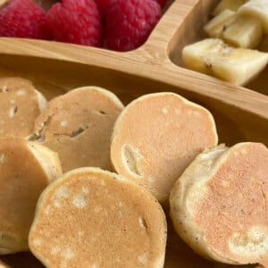 Banana pancake bites served with raspberries and sliced bananas