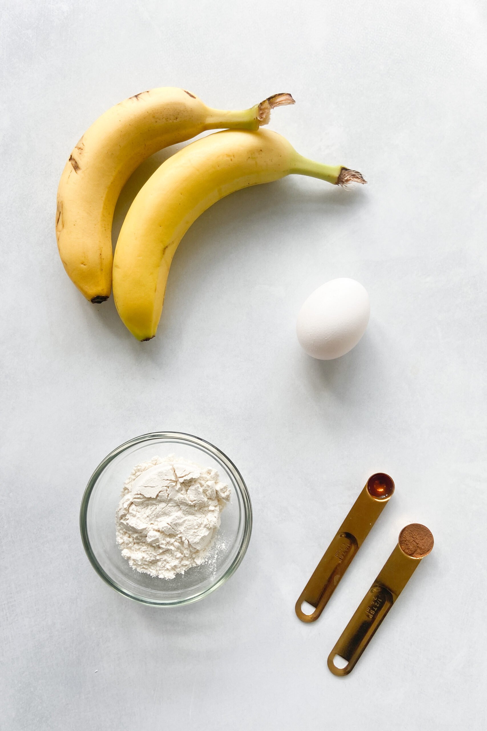 Ingredients to make banana pancake bites. See recipe card for detailed ingredients.
