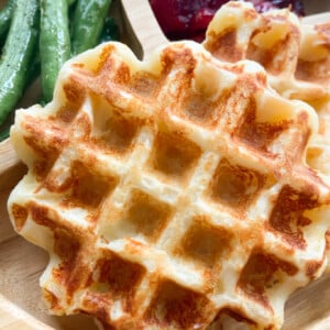 Mashed potato waffles served with green beans and mashed potatoes.