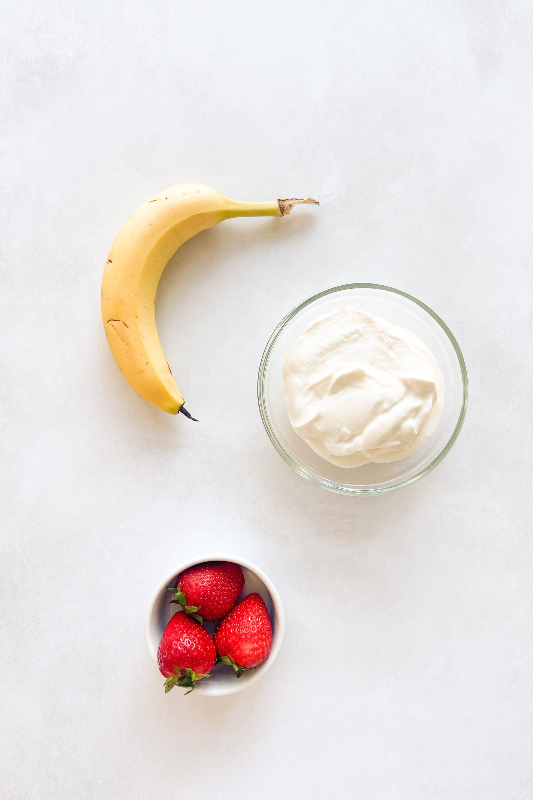 Ingredients to make strawberry banana yogurt melts. See recipe card for detailed ingredients.