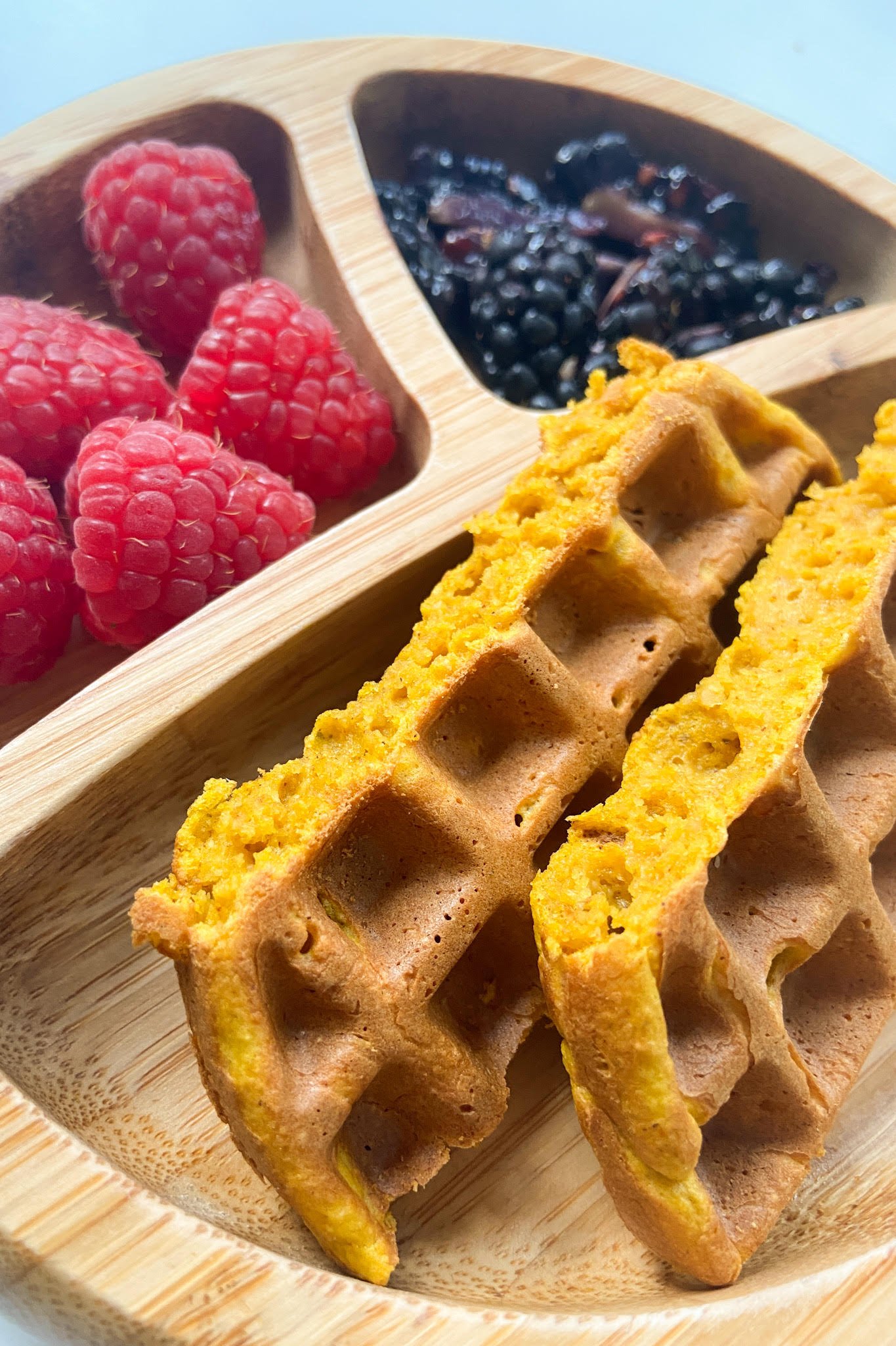 Pumpkin waffles served with raspberries and blackberries