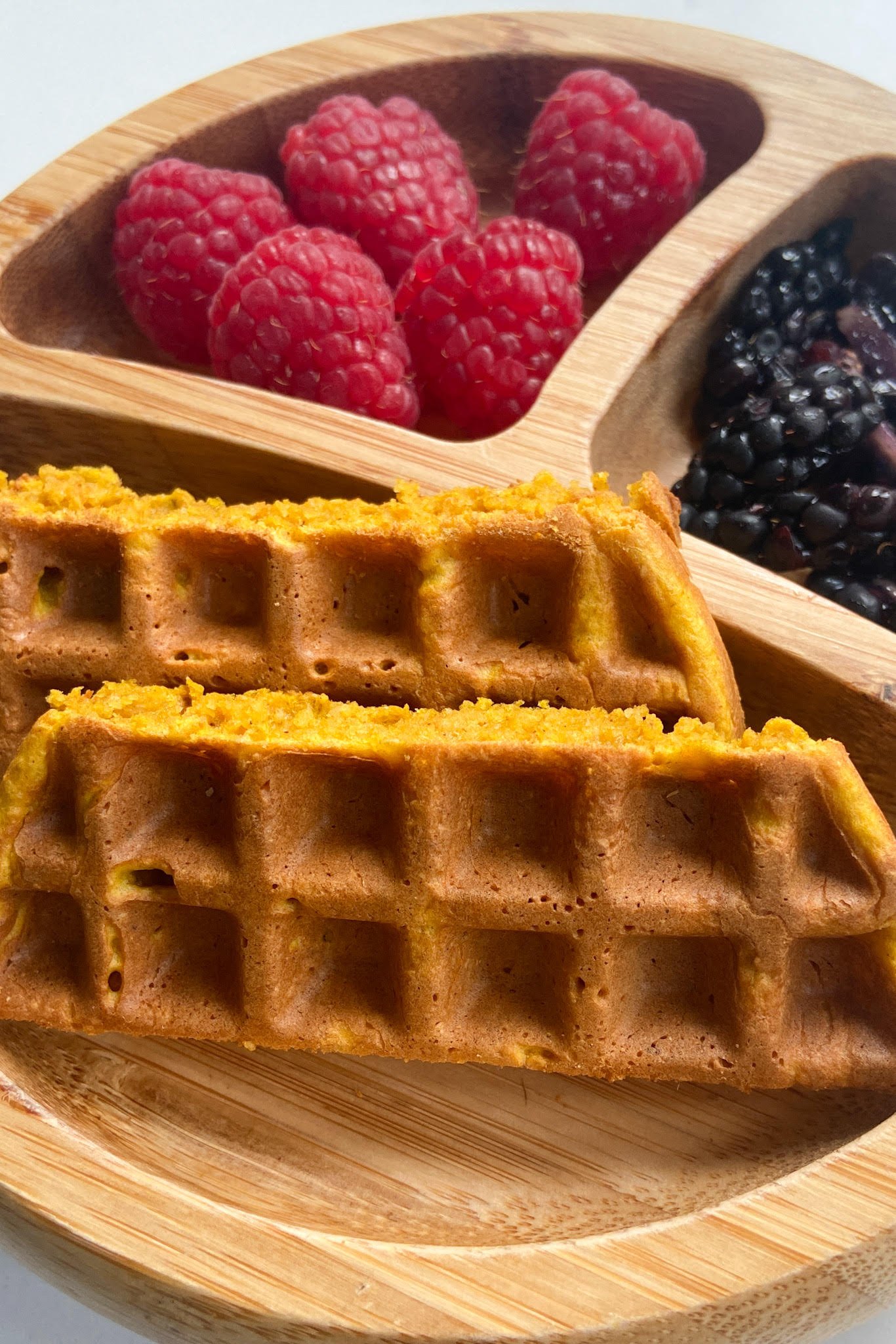 Pumpkin waffles served with raspberries and blackberries