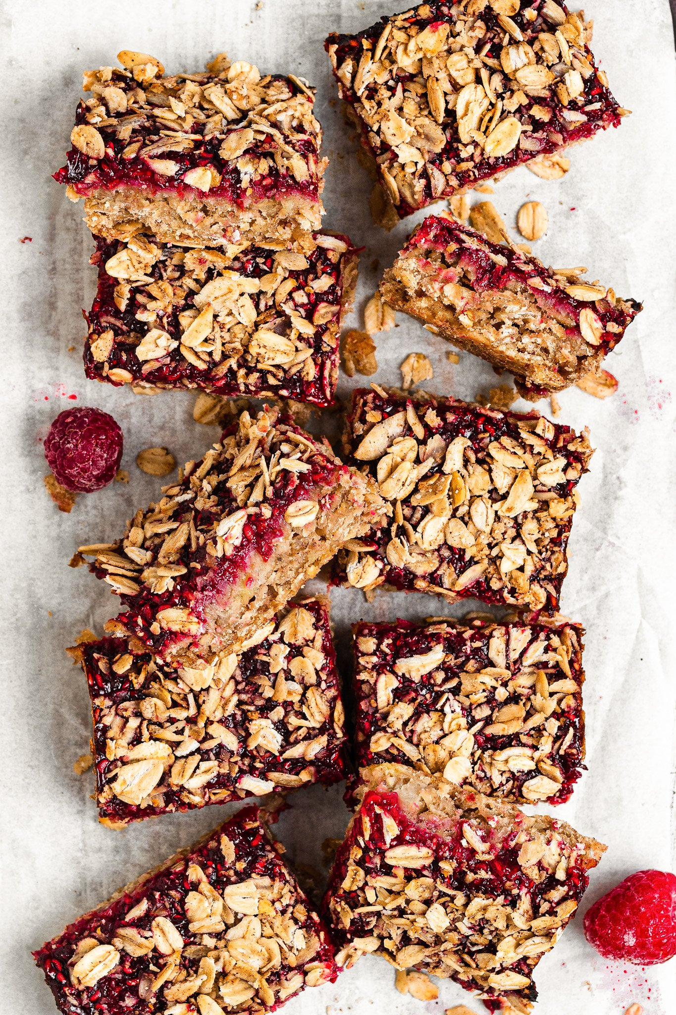 Raspberry oat bars cut into squares.