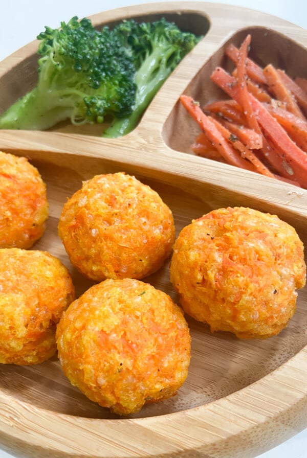 Cheesy carrot bites served with broccoli and carrots