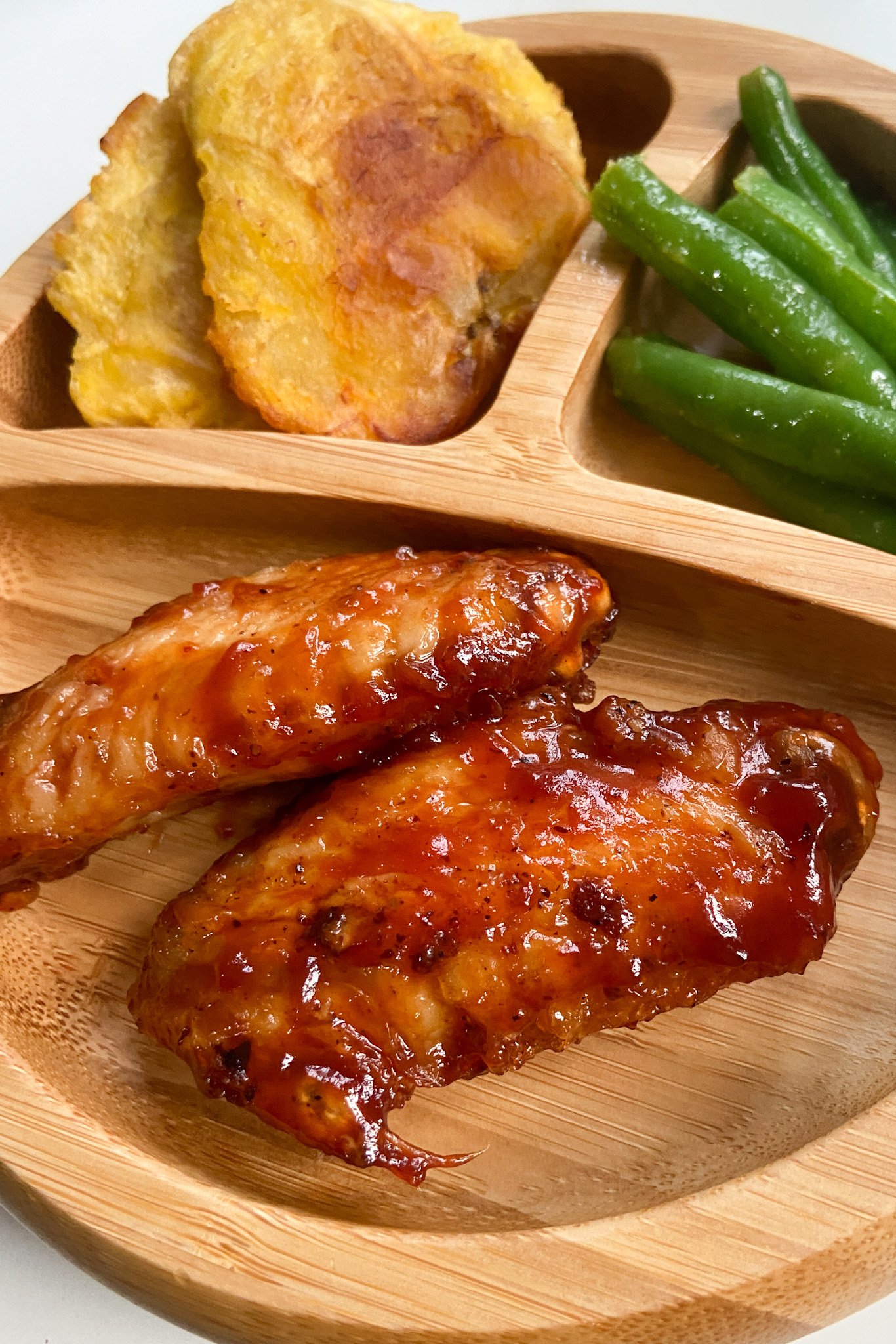 Air fryer chicken wings served with plantains and green beans