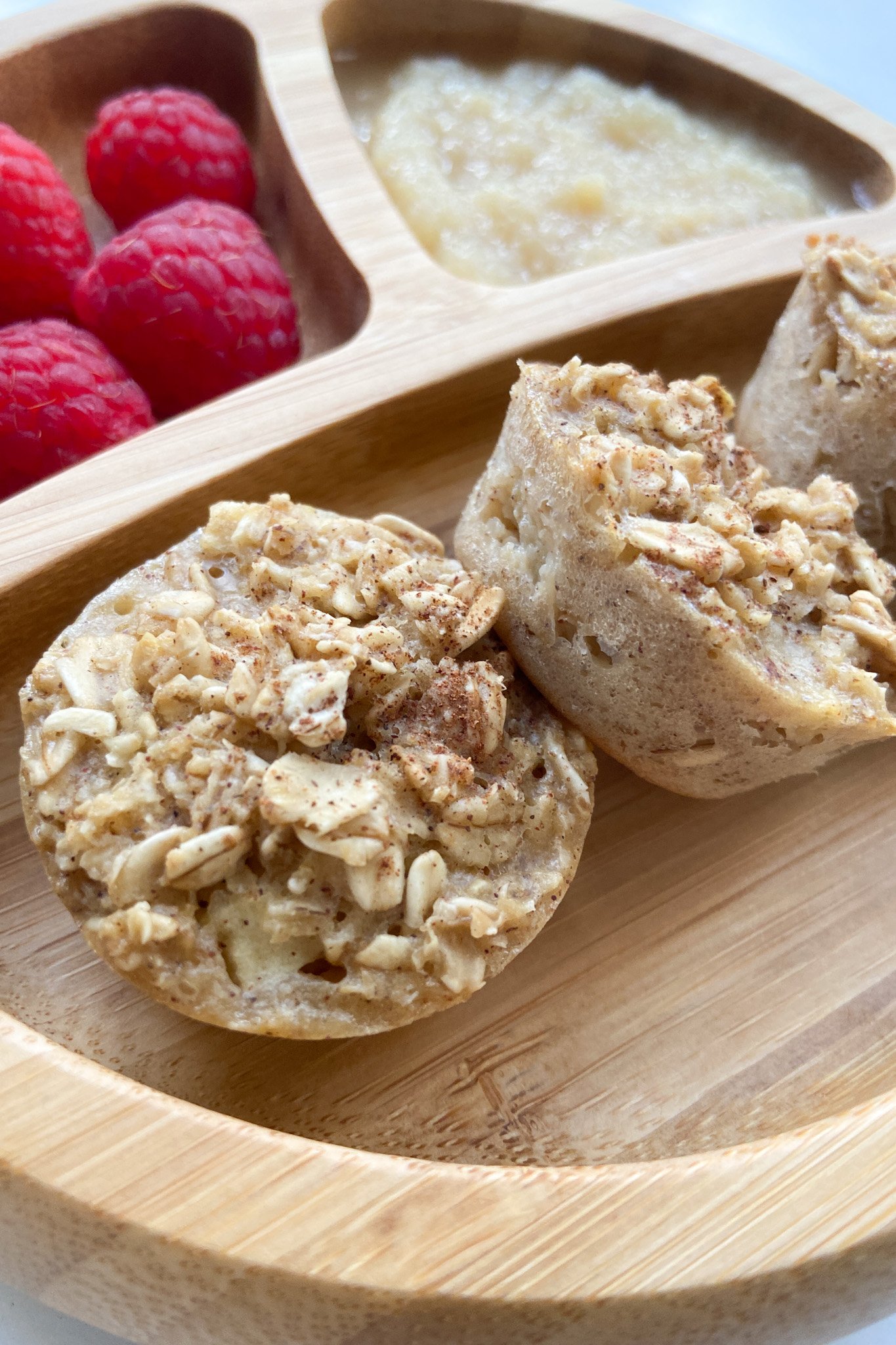 Apple oat bites served with applesauce and raspberries