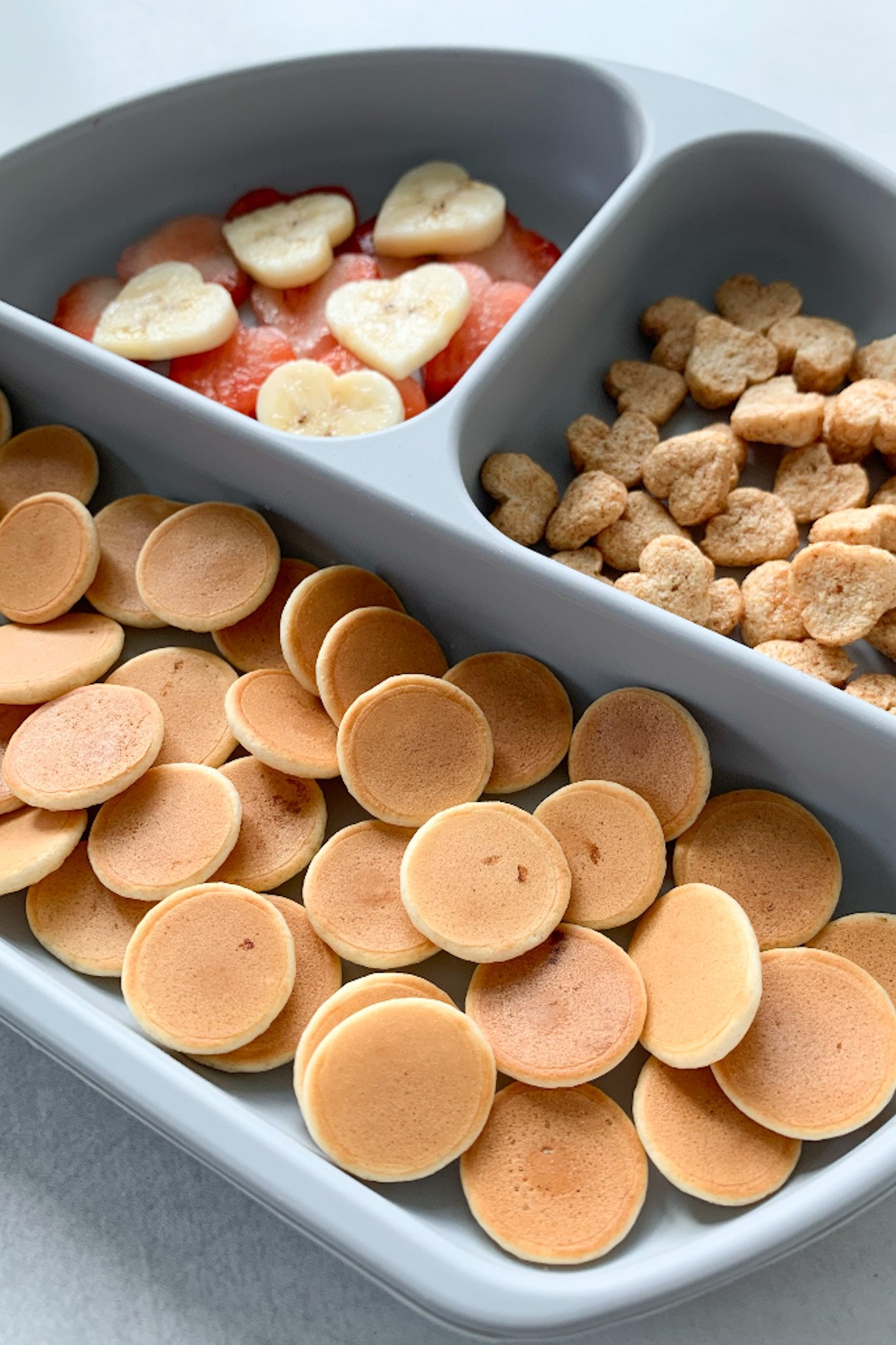 Pancake cereal served with fruits.