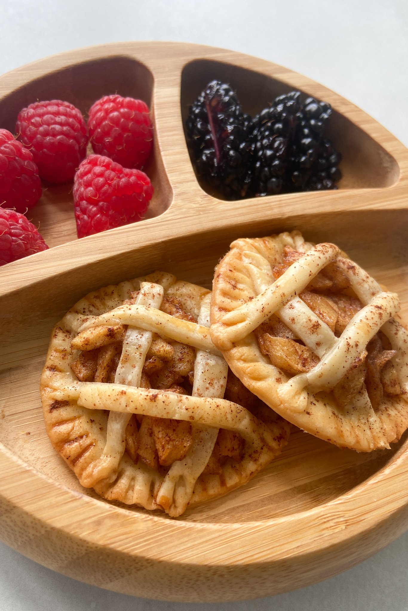 Mini apple pies served with berries