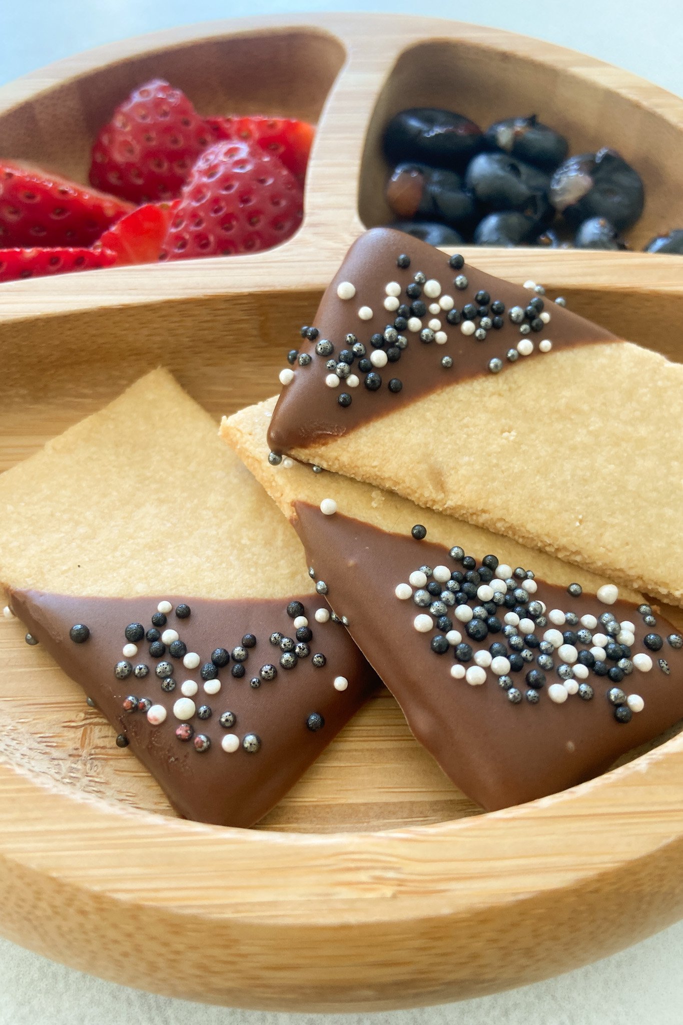 2 ingredient almond flour cookies served with berries