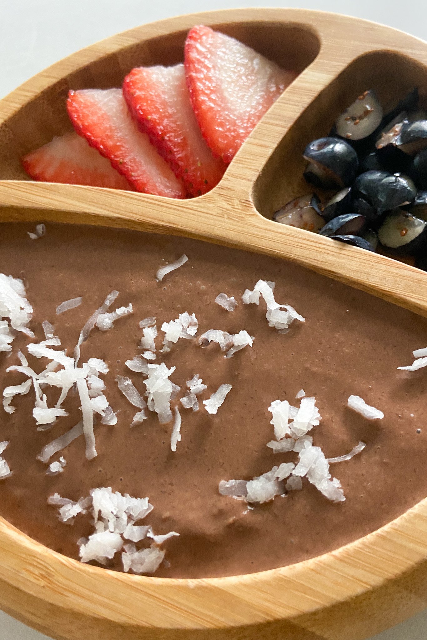 Oat chocolate pudding served with berries