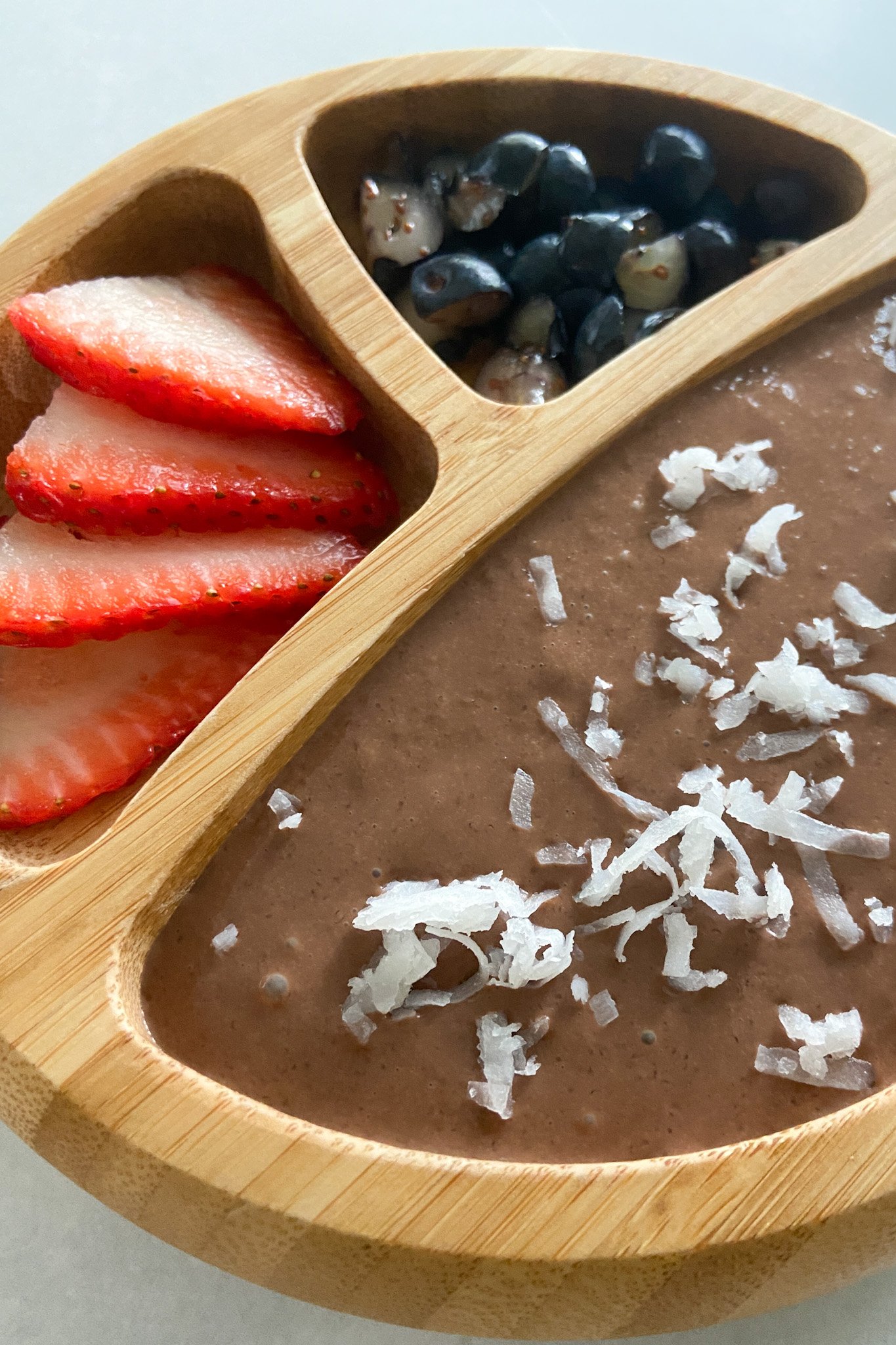 Oat chocolate pudding served with berries