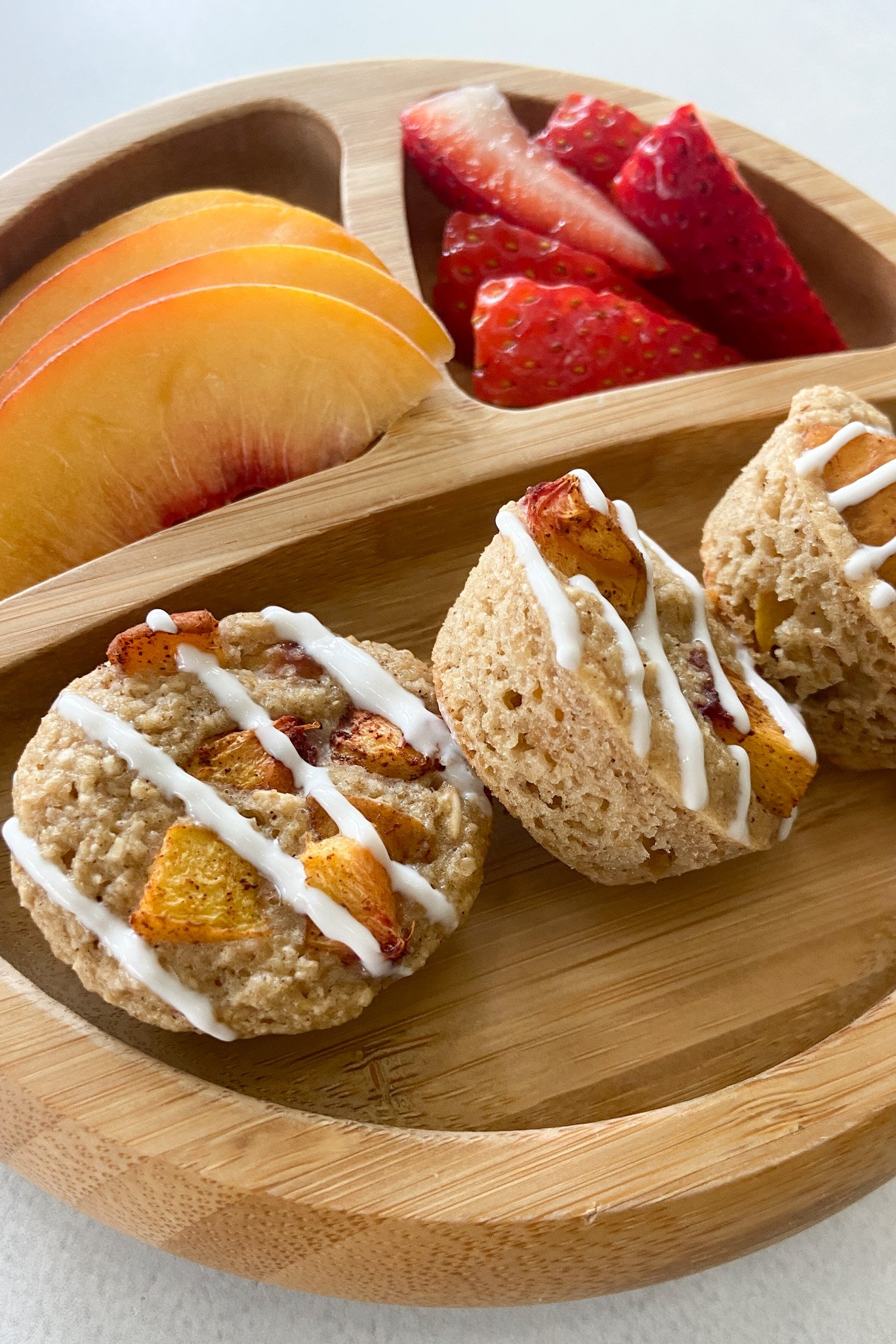Peach cobbler muffins served with fruits.