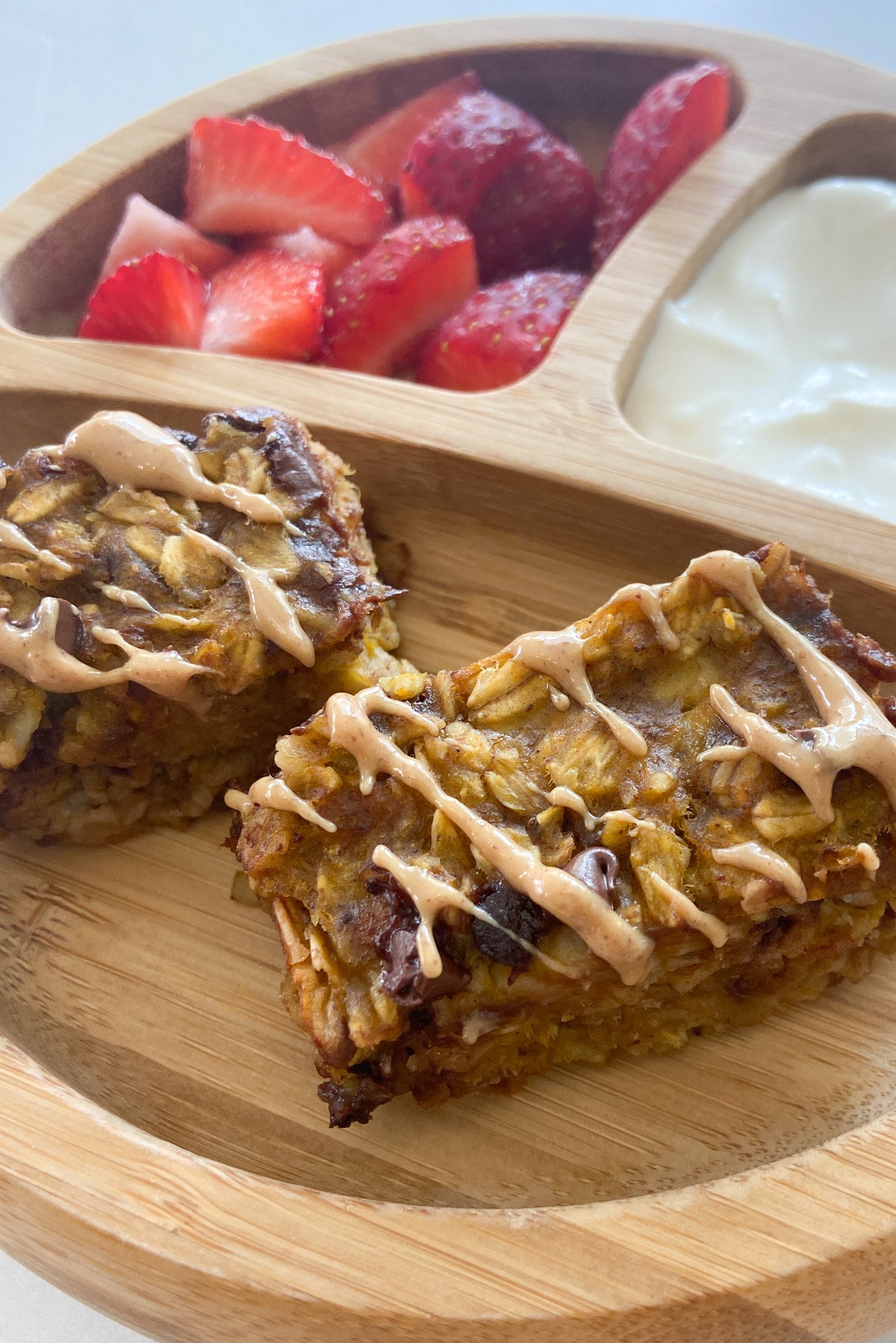 Pumpkin oatmeal bars served with berries and yogurt.