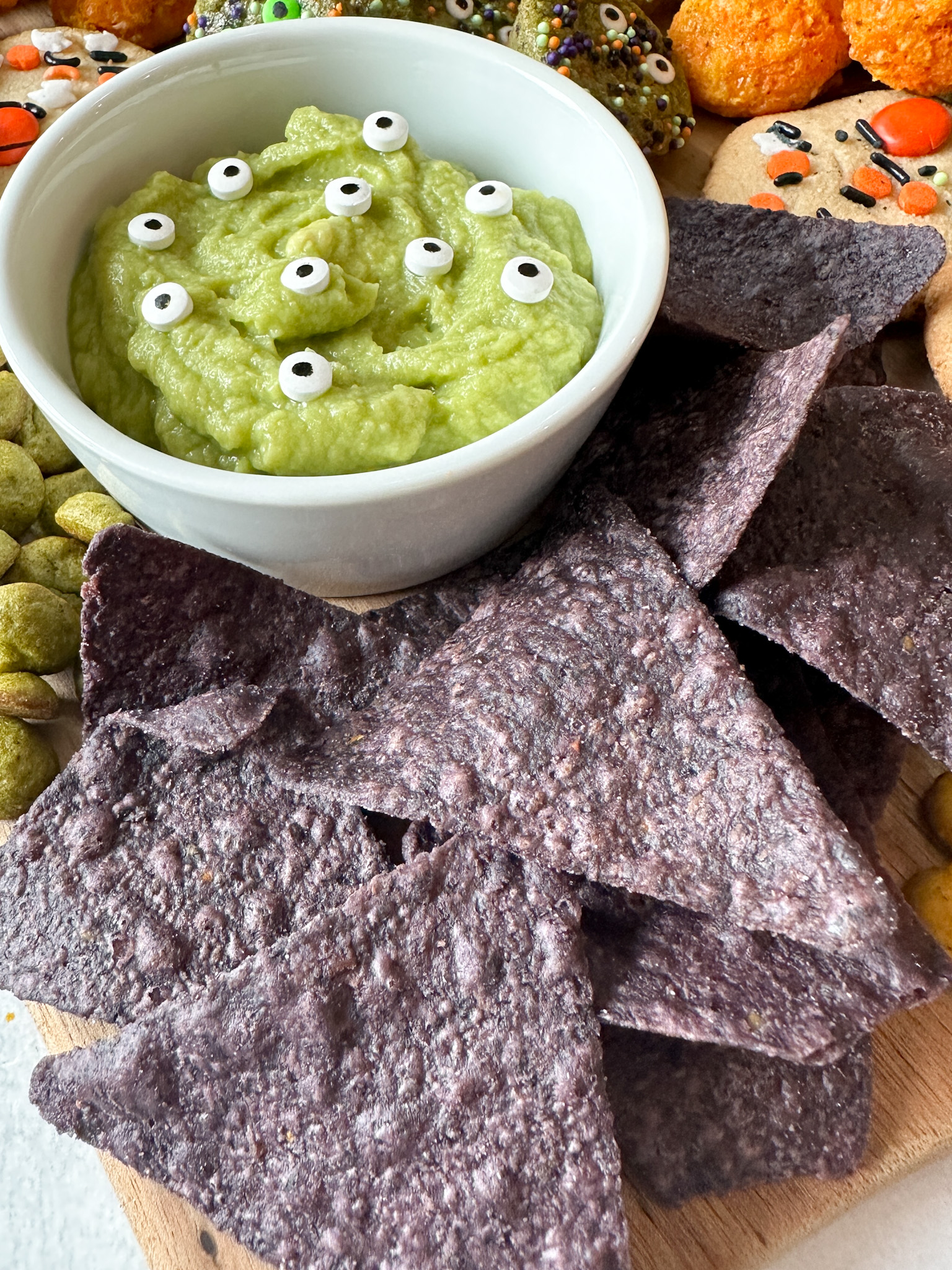 Guacamole and blue corn chips.