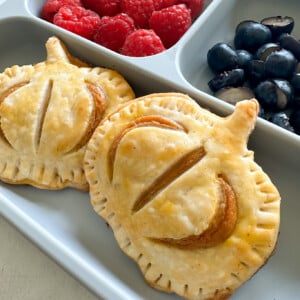Pumpkin hand pies served with fruits.