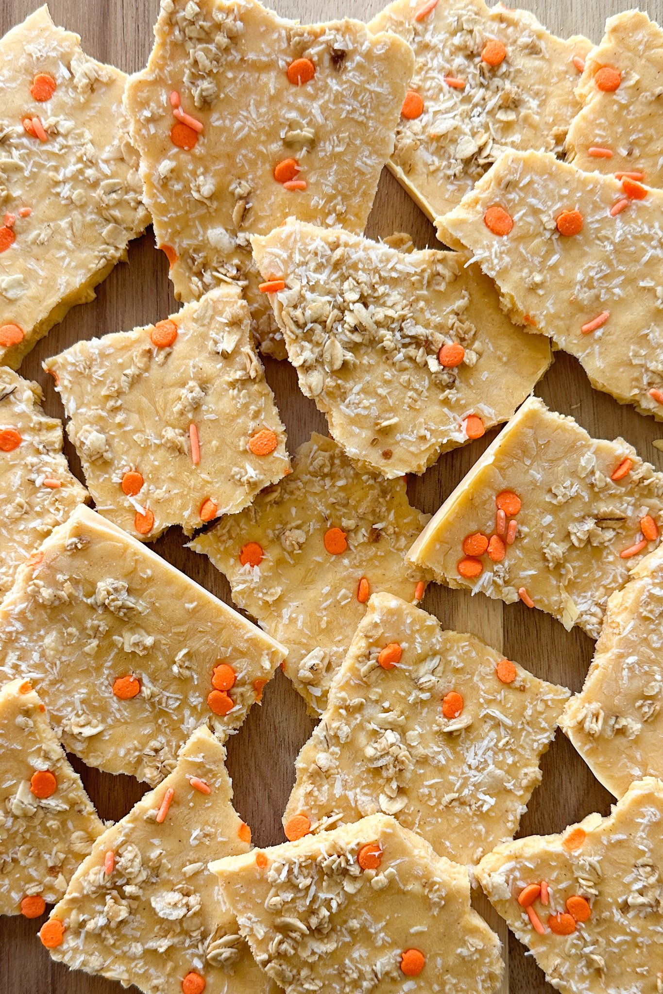 Pumpkin yogurt bark on a wooden board.