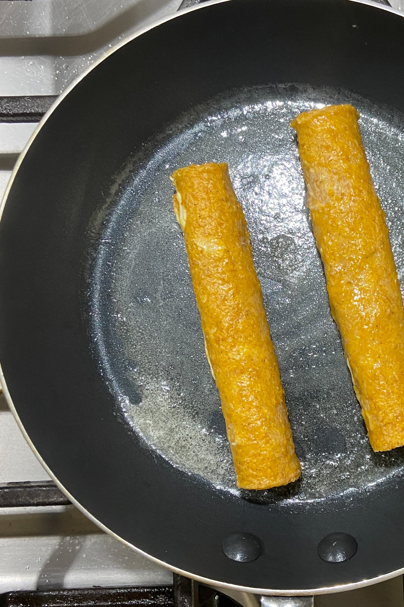 Pumpkin spiced french toast rollups cooking