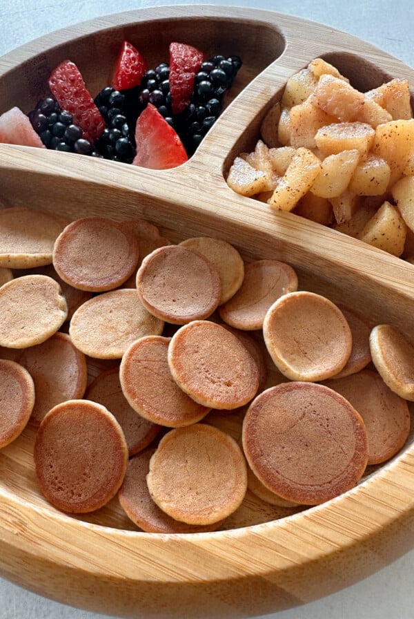 Apple flavored pancake cereal served with fruits.