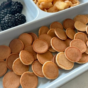 Apple flavored pancake cereal served with fruits.